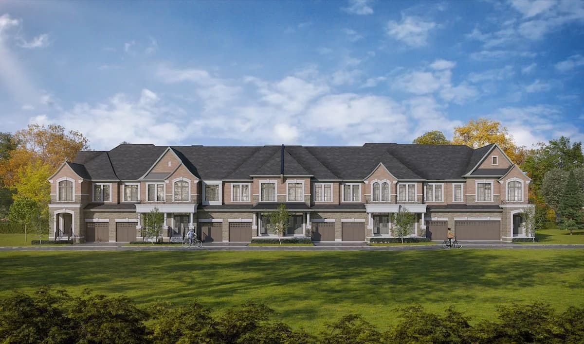 Two-storey traditional Auden Grand Towns townhome rendering with front lawns, garages and pitched roofs